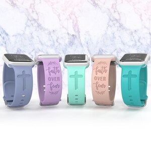 May include: Four different colored silicone watch bands with a cross and the words "faith over fear" printed on them.