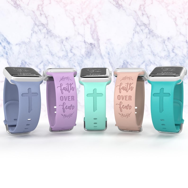 May include: Four different colored silicone watch bands with a cross and the words "faith over fear" printed on them.