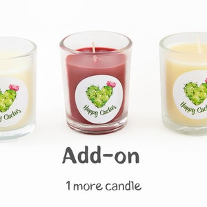 May include: Three small glass candle jars with a white, red, and yellow wax. Each jar has a round sticker with a green cactus heart and the text "Happy Cactus".