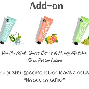 May include: Three tubes of shea butter lotion with different scents: vanilla mint, sweet citrus, and honey matcha. The tubes are labeled with the scent and have a white background with black text. The image also includes a sprig of mint, a slice of grapefruit, and a pile of matcha powder.