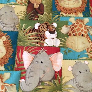 Jungle babies primary colors hand quilted baby quilt-lion, monkey, giraffe, hippo, tiger baby quilt-measures 43.5x36 inches
