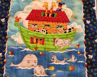 Brightly colored Noah’s Ark baby quilt-hand quilted-Bible story-measures 41.5x35 inches-