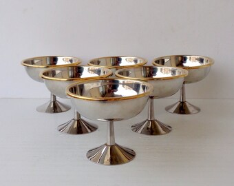 six ice cream cups made in Italy 80 in steel and golden edge, Used little, like new, height 9.5 cm, upper diameter 11.5 cm, capacity 200 ml