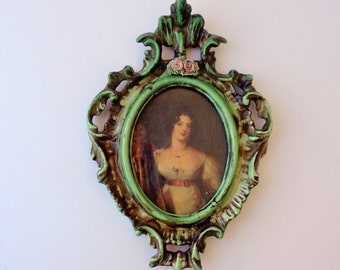 Antique ceramic frame with an image of a woman from the period with glass, hand decorated height 21 cm width 14.5 cm weight 220 grams