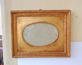frame in wood , vintage Made in Italy, Baroque style, height 36cm width 44.7cm ,internal measurements of the oval height 17.5cm width 26.5cm