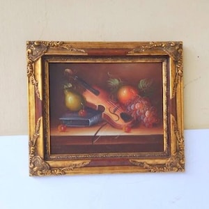 イタリア製のバロック様式の額縁に入った木製の絵画。プリントの高さは