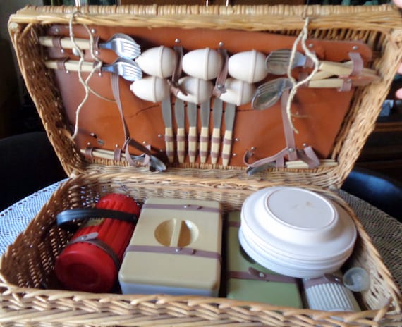 Collectible old picnic wicker basket With Dishware