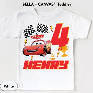 A white t-shirt with a design featuring the character Lightning McQueen from the Cars movie, along with a number 4 and the text "HENRY".