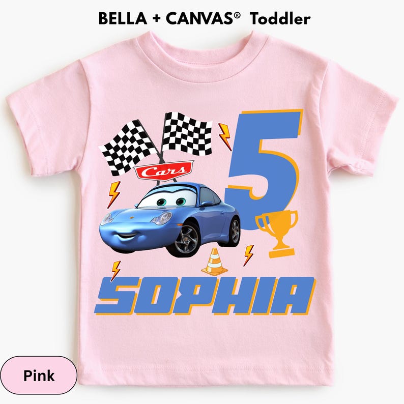 A pink t-shirt with a design featuring a blue race car and the number 5, along with the text "Sophia" and other related elements.