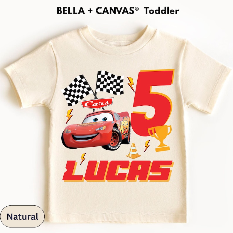 A white t-shirt with a design featuring a red race car and checkered flags, along with the text "Lucas" and the number "5".