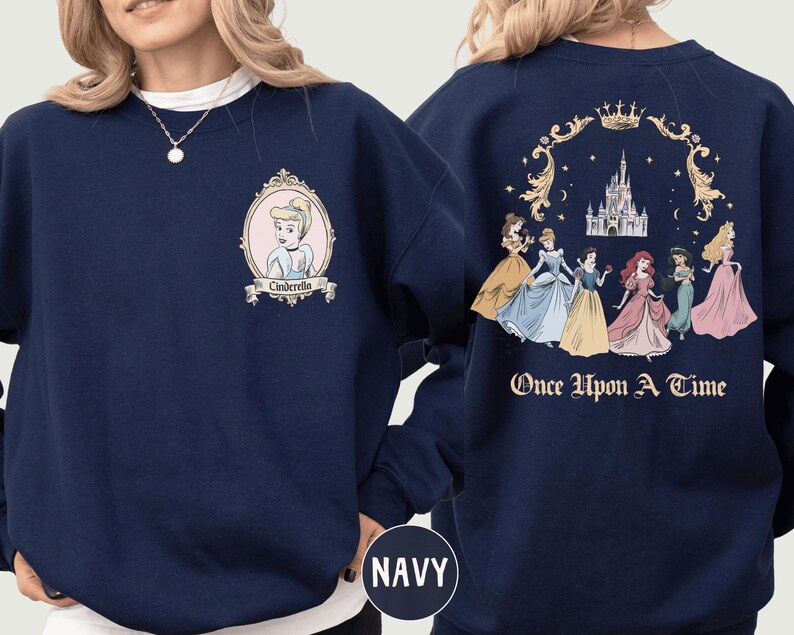 A navy blue sweatshirt with a design featuring the Disney princess characters Cinderella and the fairy tale story "Once Upon a Time".