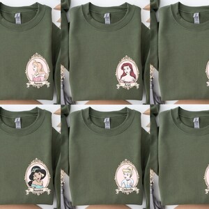 The image is a collage of six green t-shirts, each featuring a different Disney princess. The t-shirts are arranged in a grid pattern, with each shirt displaying a different Disney princess.
