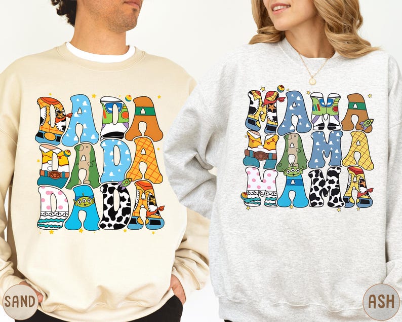 two people wearing sweatshirts with a colorful, cartoon-style design.