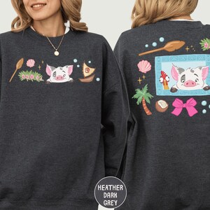 two different views of a gray sweatshirt with a cartoon pig design on the front and back.