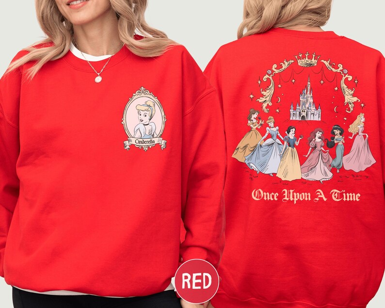 A red sweatshirt with a design featuring the Disney princesses from "Cinderella" and the text "Once Upon a Time" on the back.