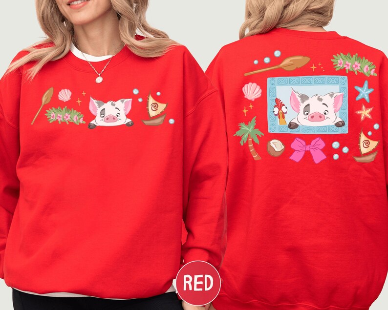 A red sweater with a cartoon pig design and various decorative elements, including a palm tree, seashells, starfish, and a bow.