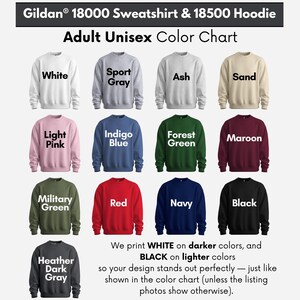 The image is an adult unisex color chart featuring a variety of sweatshirt and hoodie colors, including white, sport gray, ash, sand, light pink, indigo blue, forest green, maroon, military green, red, navy, black, and Heather Dark Gray.