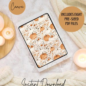 Può includere: Un tablet digitale mostra un motivo a tema autunnale con zucche ed elementi floreali. Il tablet è in una custodia bianca, con le parole "Canva" e "Includes Eight Pre-Sized PDF Files" sullo sfondo. Sono visibili anche le parole "Instant Download".