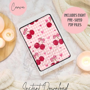 May include: A digital tablet shows a cherry design with a pink gingham background, cherries, and bows. The tablet is in a white case, with the words "Canva" and "Instant Download" visible. The image includes the text "Includes Eight Pre-Sized PDF Files."