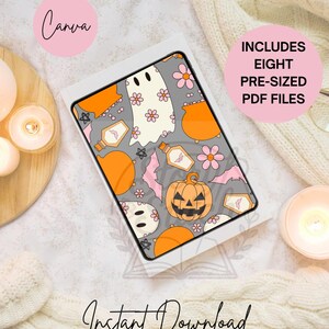 May include: A tablet displaying a Halloween design with ghosts, pumpkins, bats, and flowers in orange, pink, and white on a grey background. Text includes "Includes Eight Pre-Sized PDF Files" and "Instant Download".