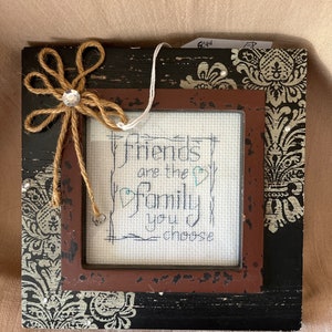 4 1/2” square “Friends…” frame, Black w/ silver design, rustic center and twine flower in upper left corner.