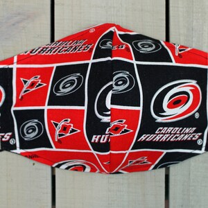 NHL Carolina Hurricanes 100% cotton, sold by 1/2 yard, sports fan,  decorative, gift, man cave, official fabric, mask fabric