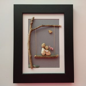 couple on swing - romantic framed pebble art