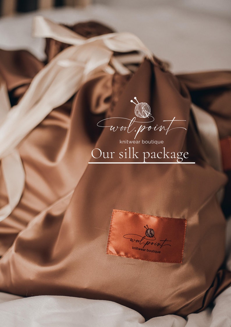 May include: A brown silk pouch with a white logo that says "wool.point knitwear boutique" and the text "Our silk package".