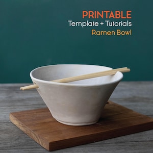 May include: A white ramen bowl with wooden chopsticks, set on a small wooden board. The image includes the text "PRINTABLE Template + Tutorials Ramen Bowl". The bowl is likely for serving Asian cuisine.