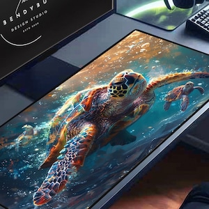 May include: A colorful, abstract design of a sea turtle swimming in a blue and green ocean. The turtle is surrounded by bubbles and light. The design is on a black rectangular mouse pad.