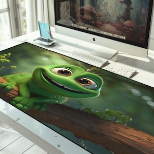 May include: A green cartoon chameleon with large eyes and a wide smile sits on a branch in a forest setting. The chameleon is looking directly at the viewer. The background is a blurred green and brown.