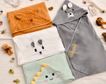 Personalized animal-themed hooded baby towel, embroidered with your baby's name. Commemorative gift.