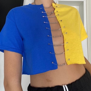 reworked two toned blue and yellow crop top with chains and safety pins