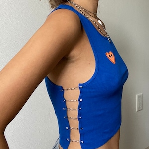 handmade blue top with chains and safety pins and orange heart patch