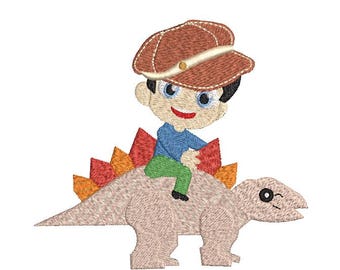 Boy with a fun Baker Boy Hat on a Dinosaur Machine Embroidery Design