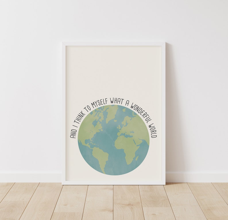 May include: A white framed print with a blue and green globe illustration and the text "And I think to myself what a wonderful world".
