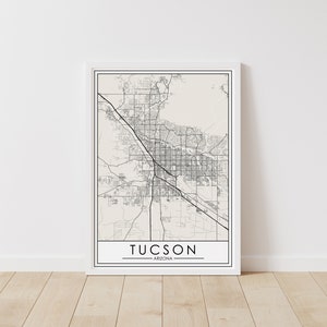 May include: A black and white map print of Tucson, Arizona. The map shows the city streets and surrounding areas. The city name is printed at the bottom of the map.