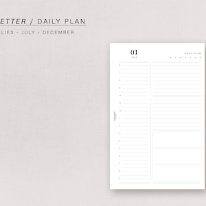 May include: A black and white daily planner with the text "HALF LETTER / DAILY PLAN" and "DATED DAILIES - JULY - DECEMBER" at the top. The planner has a date of "01 JULY" and a section for daily planning.