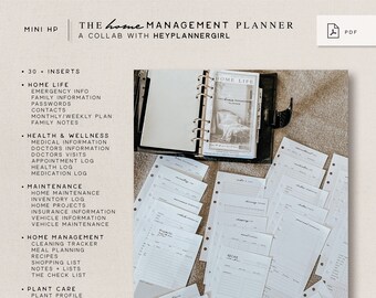 May include: A white binder with 30 inserts for home management. The inserts include sections for home life, health and wellness, maintenance, home management, plant care, and pet care. The binder is open and the inserts are visible. The text "THE home MANAGEMENT PLANNER" is visible at the top of the image.