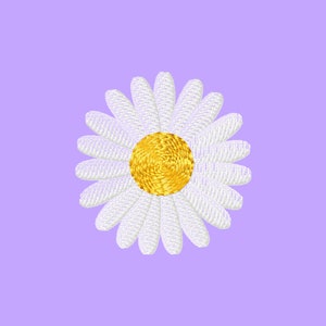 May include: A white daisy with a yellow center, embroidered on a light purple background.