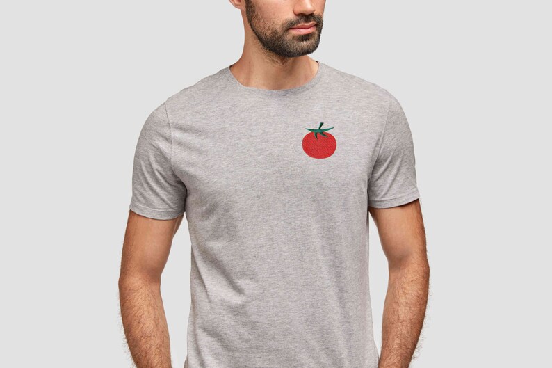May include: A gray t-shirt with a red tomato graphic on the front.