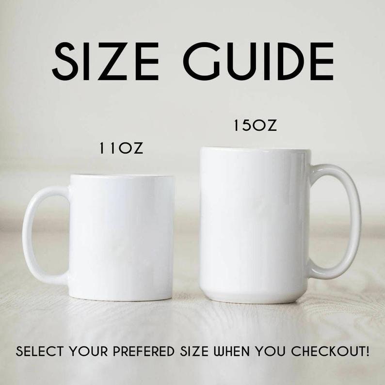May include: A size guide for two white ceramic mugs. The smaller mug is labeled 11oz and the larger mug is labeled 15oz. The text at the top reads SIZE GUIDE and the text at the bottom reads SELECT YOUR PREFERED SIZE WHEN YOU CHECKOUT!