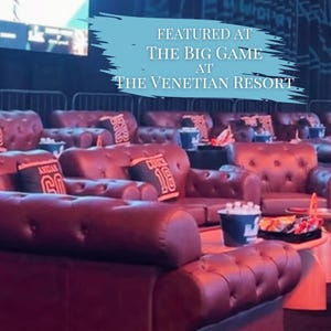 May include: A row of dark brown tufted leather sofas with button detailing, each featuring small rectangular pillows with jersey-style numbers. A light blue graphic overlay reads: FEATURED AT THE BIG GAME AT THE VENETIAN RESORT.