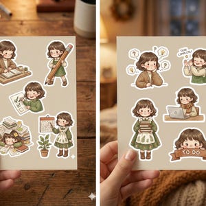 Op de afbeelding: Twee vellen stickers met illustraties van een stripmeisje in verschillende poses. De stickers beelden het meisje uit dat studeert, een potlood vasthoudt en op een laptop werkt. De stickers zijn in een warm kleurenpalet.