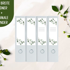 Może przedstawiać: Cztery białe etykiety do segregatorów z zielonym wzorem liści. Etykiety są zarówno do segregatorów szerokich, jak i wąskich. Tekst na etykietach brzmi "FÜR BREITE ORDNER + SCHMALE ORDNER".
