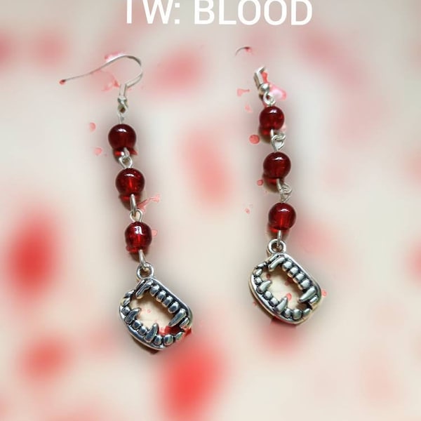 rip out our necks- vampire fang metal earrings