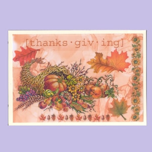 May include: A rectangular greeting card with a light orange background featuring the text [thanks·giv·ing]. The illustration shows a woven cornucopia filled with pumpkins, grapes, and wheat, surrounded by autumn leaves and a vertical sunflower border.