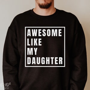 May include: Black sweatshirt with white text that reads "AWESOME LIKE MY DAUGHTER" in a box.