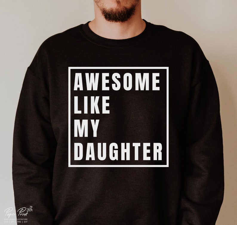 May include: Black sweatshirt with white text that reads "AWESOME LIKE MY DAUGHTER" in a box.