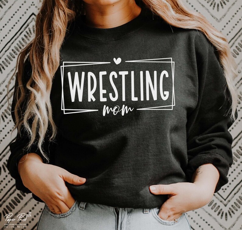 May include: Black sweatshirt with white text that says "WRESTLING mom" in a box with a small heart above the text.
